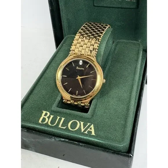 Bulova Men's Gold-Tone Diamond Accent Watch, model number 97D127.